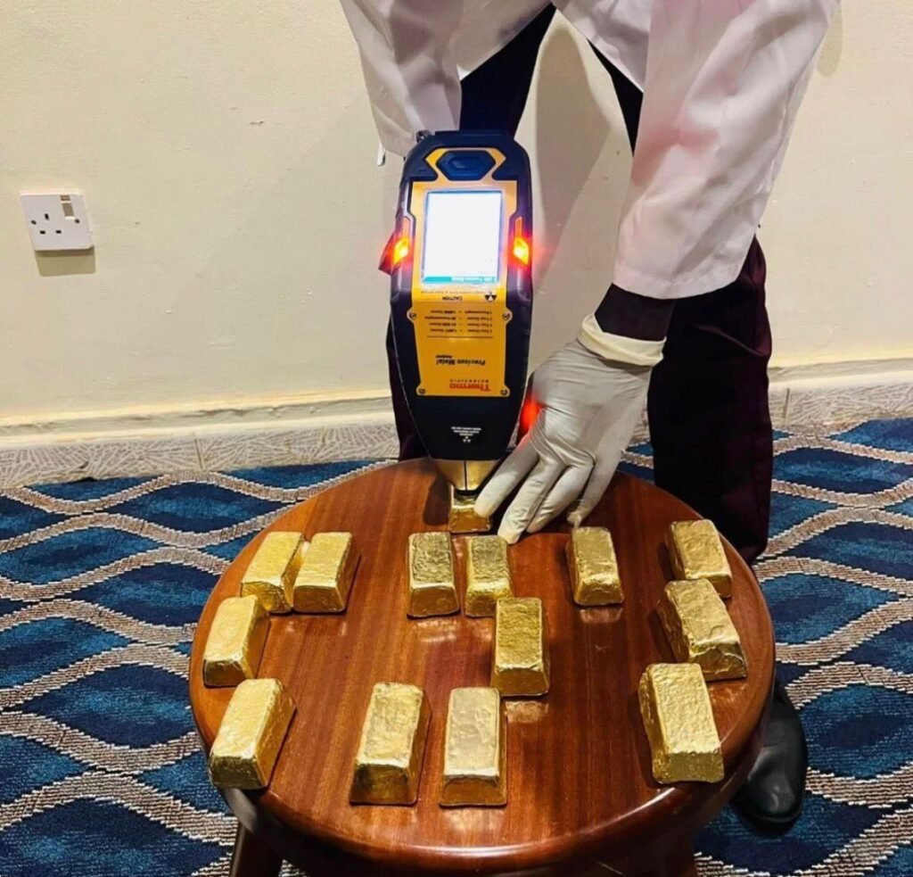 gold tester with an xrf gun testing gold bars at mineral dealers africa