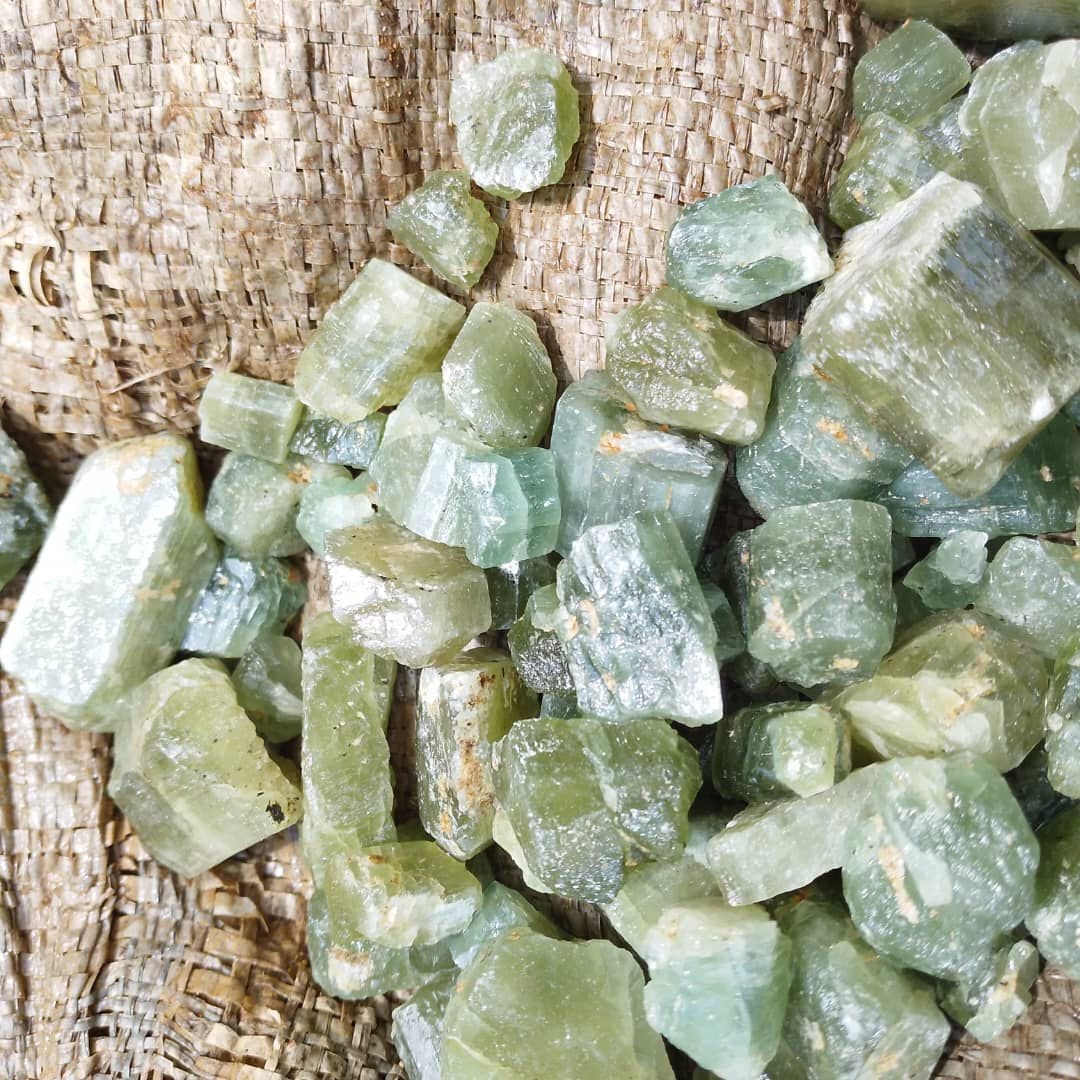 Mixed rough gemstones requiring identification before pricing and buyer listing